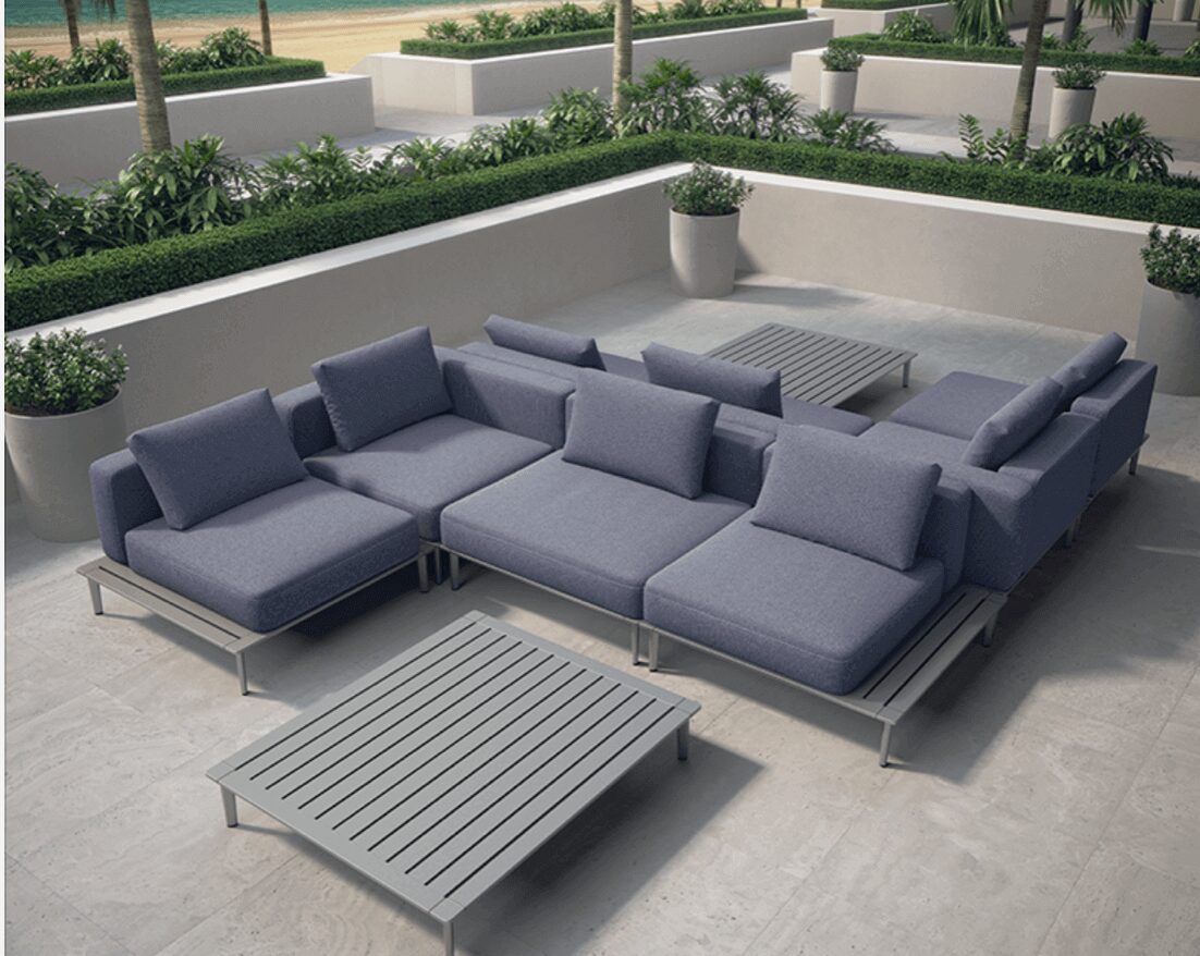 Grey colored flat sofas with a table
